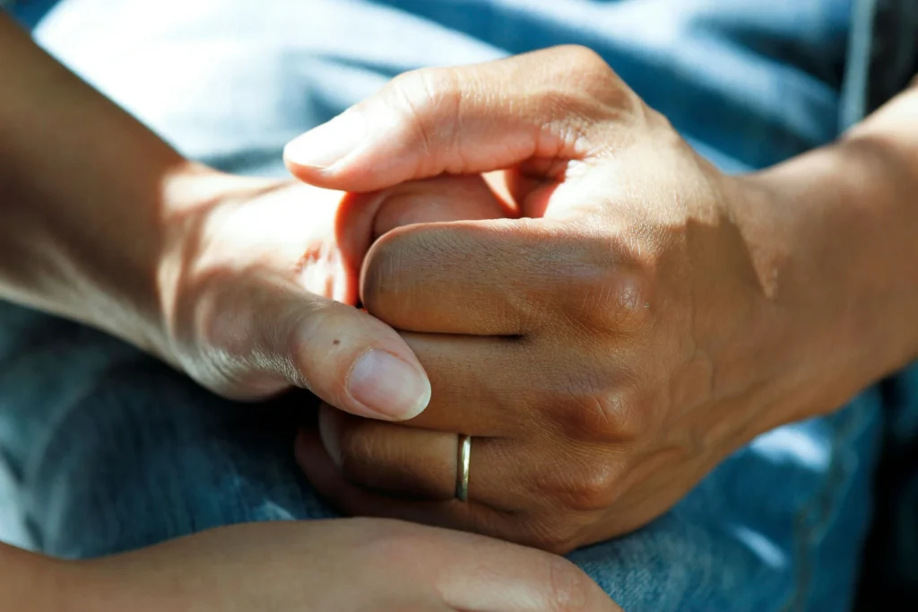 Photo of someone holding someone's hand